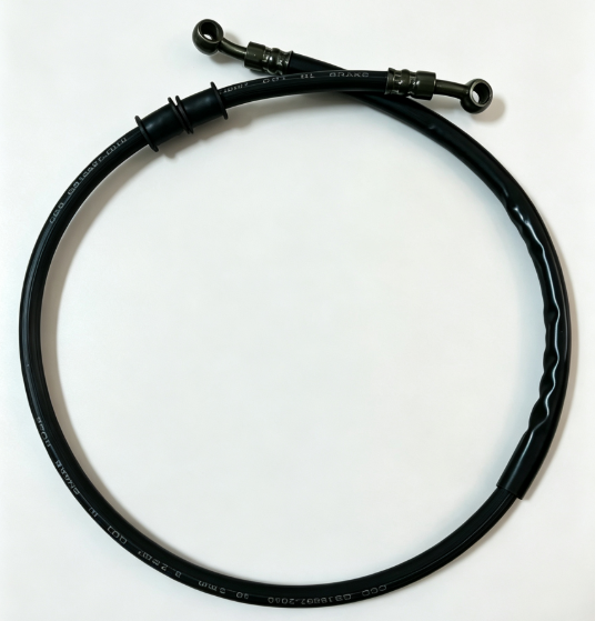 Black spring guard hydraulic hose with bent banjo fittings